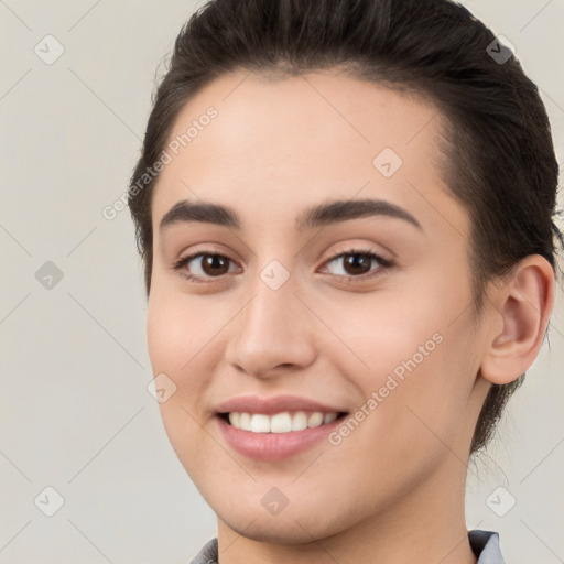 Joyful white young-adult female with short  brown hair and brown eyes