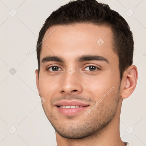 Joyful white young-adult male with short  brown hair and brown eyes