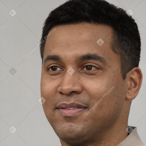 Joyful latino young-adult male with short  black hair and brown eyes