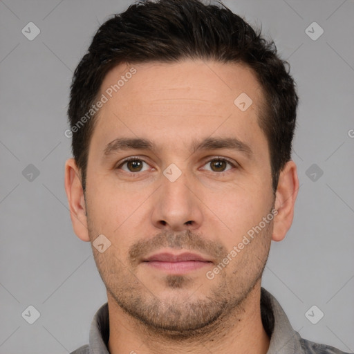 Joyful white adult male with short  brown hair and brown eyes