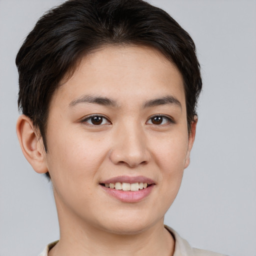 Joyful asian young-adult female with short  brown hair and brown eyes