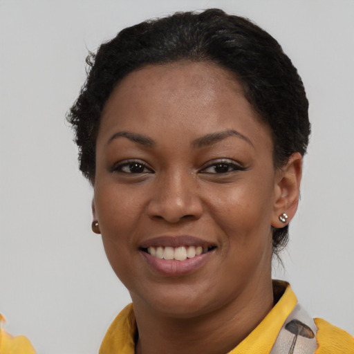 Joyful latino young-adult female with short  brown hair and brown eyes