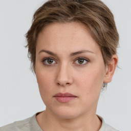 Neutral white young-adult female with short  brown hair and grey eyes