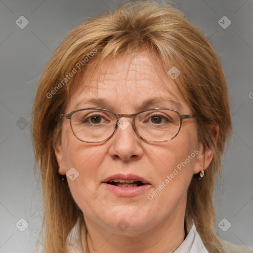 Joyful white middle-aged female with medium  brown hair and blue eyes