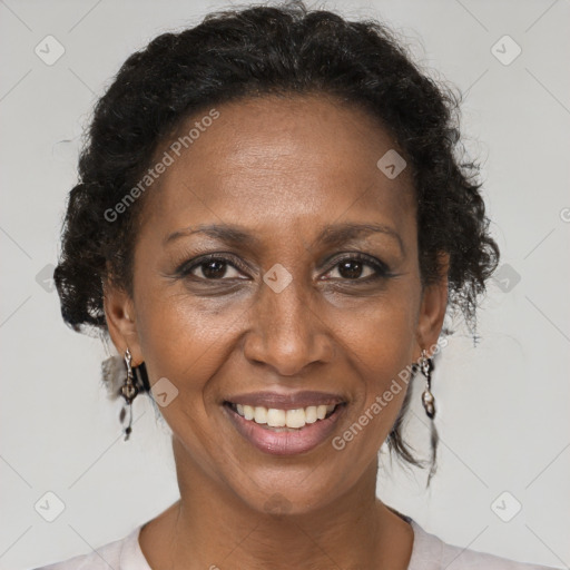 Joyful black adult female with short  brown hair and brown eyes