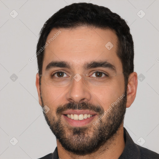 Joyful white young-adult male with short  black hair and brown eyes