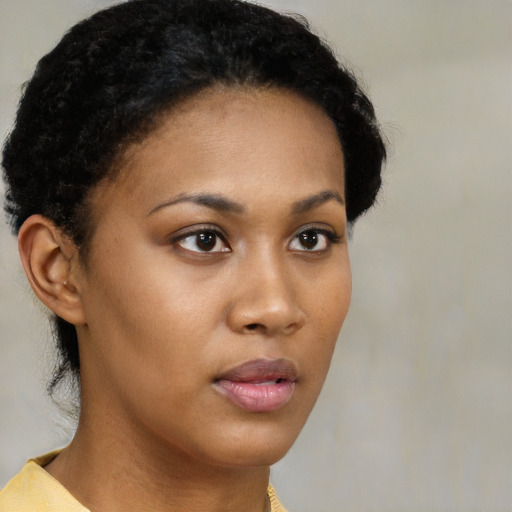 Neutral black young-adult female with short  black hair and brown eyes