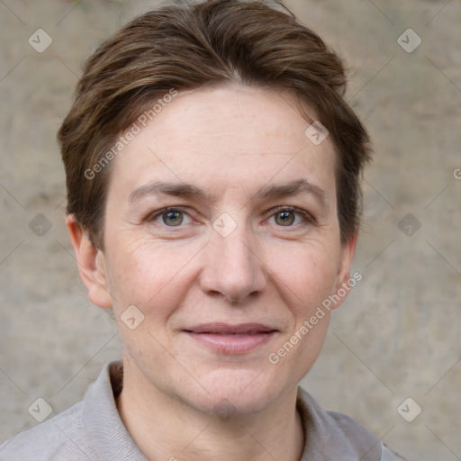 Joyful white adult female with short  brown hair and grey eyes