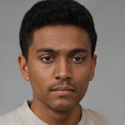 Neutral latino young-adult male with short  brown hair and brown eyes
