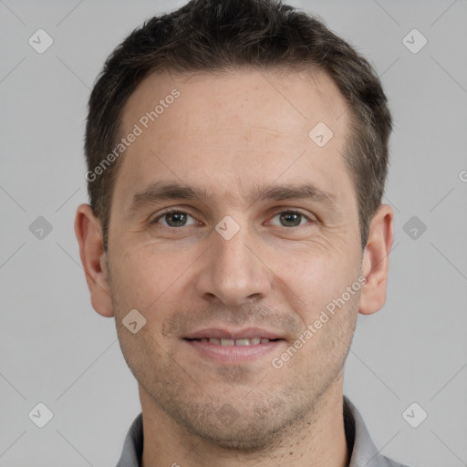 Joyful white adult male with short  brown hair and grey eyes