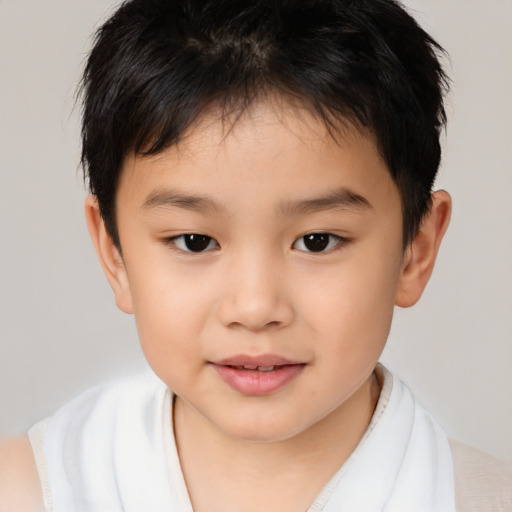 Joyful white child male with short  brown hair and brown eyes