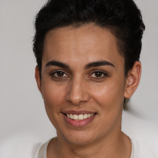 Joyful white young-adult female with short  brown hair and brown eyes