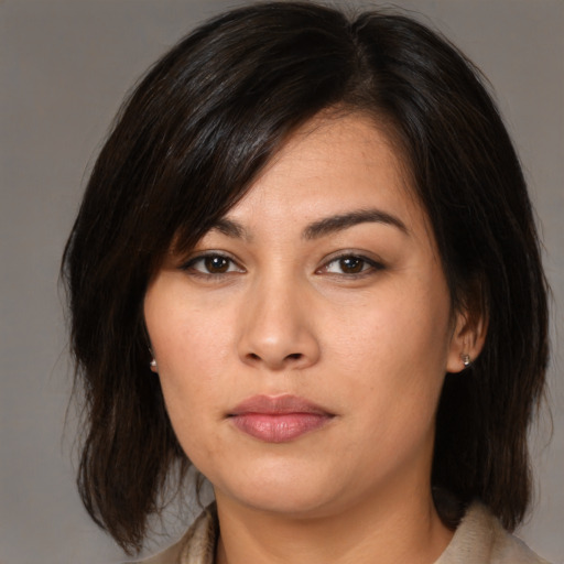 Joyful asian young-adult female with medium  brown hair and brown eyes