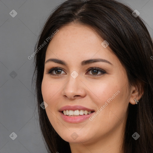 Joyful white young-adult female with long  brown hair and brown eyes