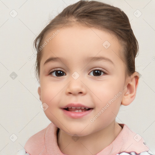 Joyful white child female with short  brown hair and brown eyes