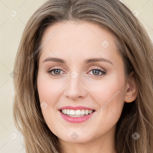 Joyful white young-adult female with long  brown hair and green eyes