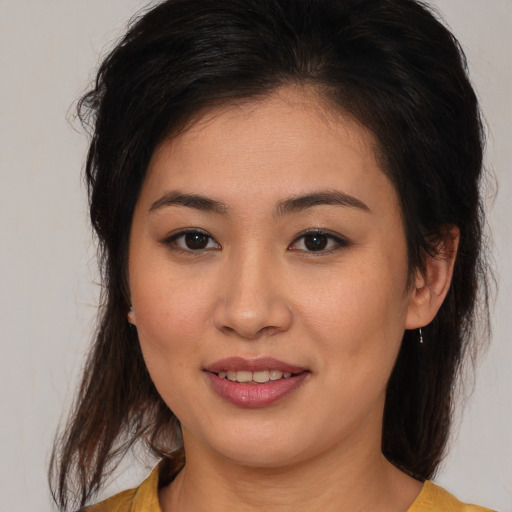 Joyful white young-adult female with medium  brown hair and brown eyes