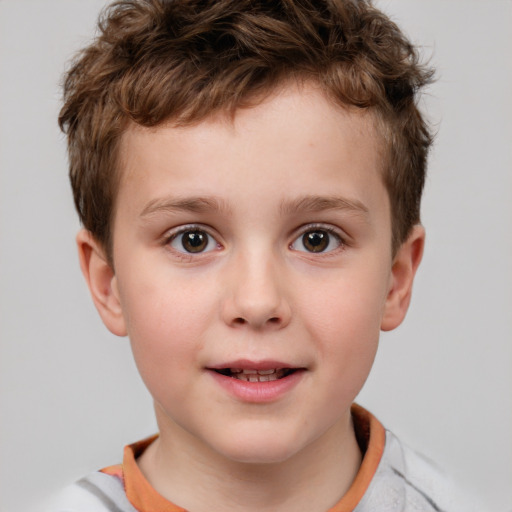 Joyful white child male with short  brown hair and brown eyes