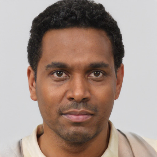 Neutral latino young-adult male with short  brown hair and brown eyes