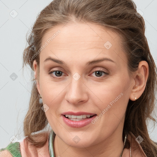 Joyful white young-adult female with medium  brown hair and grey eyes