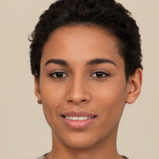 Joyful latino young-adult female with short  brown hair and brown eyes