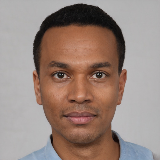 Neutral black young-adult male with short  black hair and brown eyes