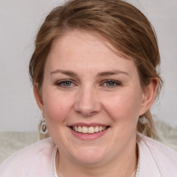 Joyful white young-adult female with medium  brown hair and blue eyes