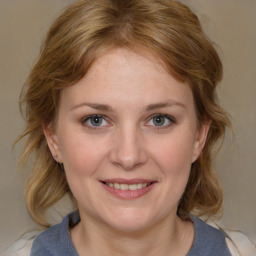 Joyful white young-adult female with medium  brown hair and blue eyes