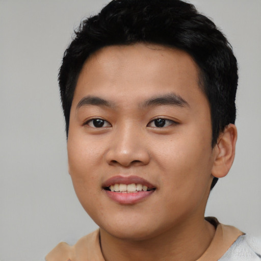 Joyful asian young-adult male with short  black hair and brown eyes