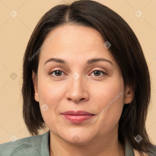 Joyful white adult female with medium  brown hair and brown eyes