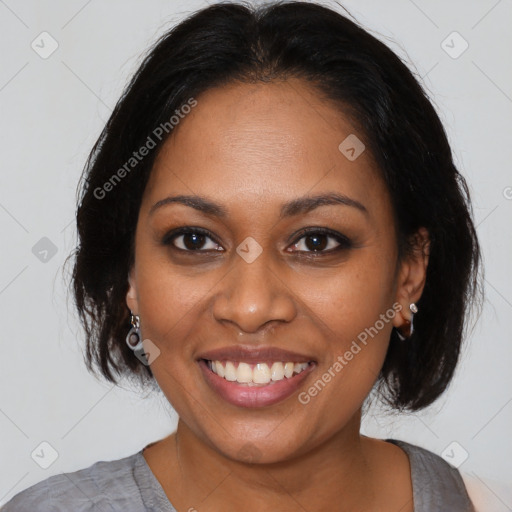 Joyful black young-adult female with medium  brown hair and brown eyes