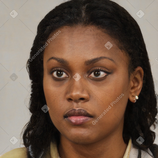 Neutral black young-adult female with long  brown hair and brown eyes