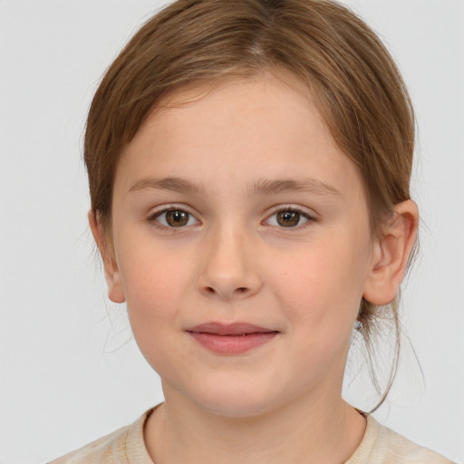 Joyful white child female with medium  brown hair and brown eyes