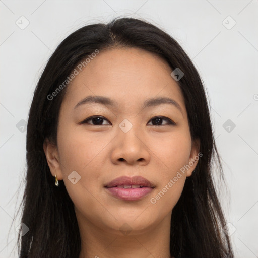 Joyful asian young-adult female with long  brown hair and brown eyes