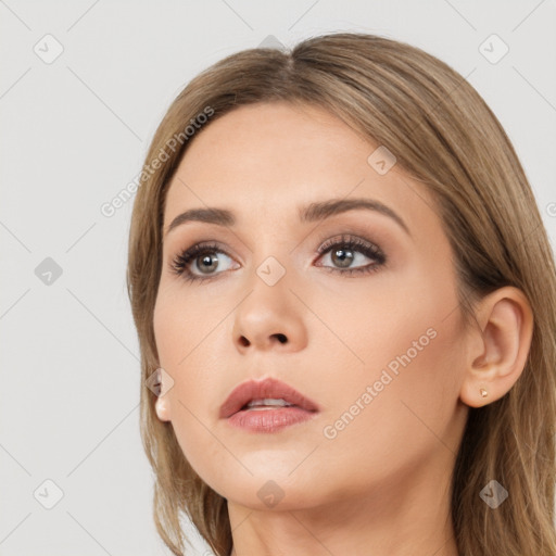 Neutral white young-adult female with long  brown hair and brown eyes