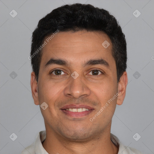 Joyful latino young-adult male with short  black hair and brown eyes