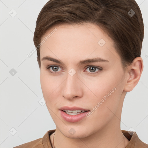 Joyful white young-adult female with short  brown hair and brown eyes