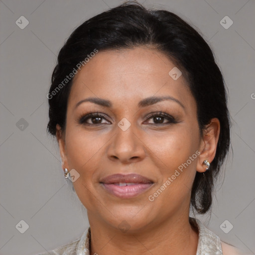 Joyful latino adult female with medium  brown hair and brown eyes