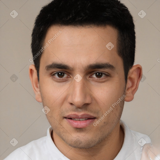 Joyful white young-adult male with short  black hair and brown eyes