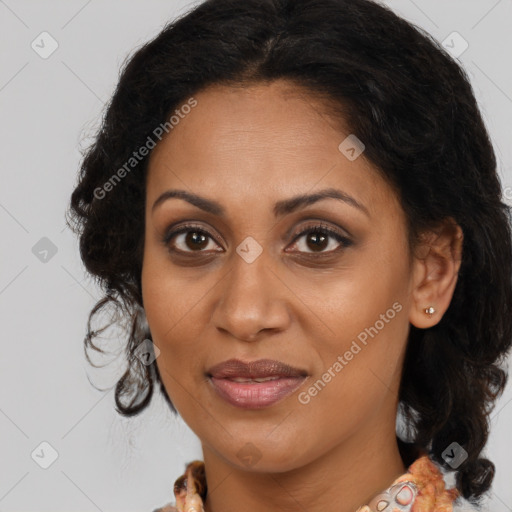 Joyful black adult female with medium  brown hair and brown eyes