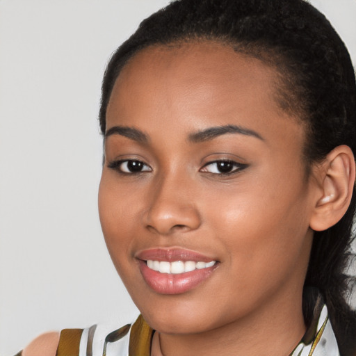 Joyful latino young-adult female with long  brown hair and brown eyes