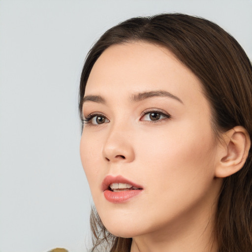 Neutral white young-adult female with long  brown hair and brown eyes