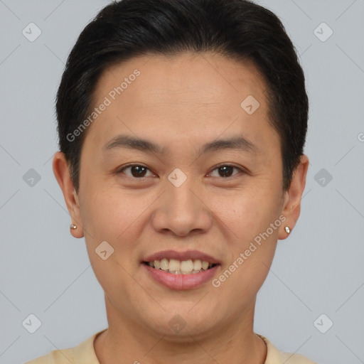 Joyful asian young-adult male with short  brown hair and brown eyes