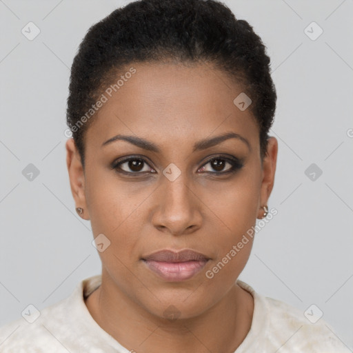 Joyful black young-adult female with short  brown hair and brown eyes