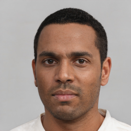 Neutral black adult male with short  black hair and brown eyes