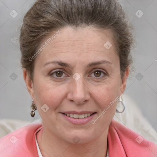 Joyful white adult female with short  brown hair and grey eyes