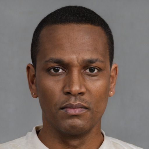 Neutral black young-adult male with short  black hair and brown eyes