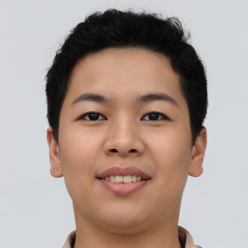 Joyful asian young-adult female with short  black hair and brown eyes