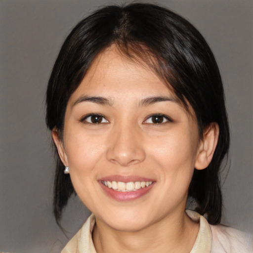 Joyful white young-adult female with medium  brown hair and brown eyes