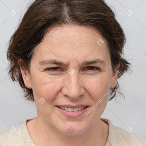 Joyful white adult female with medium  brown hair and grey eyes